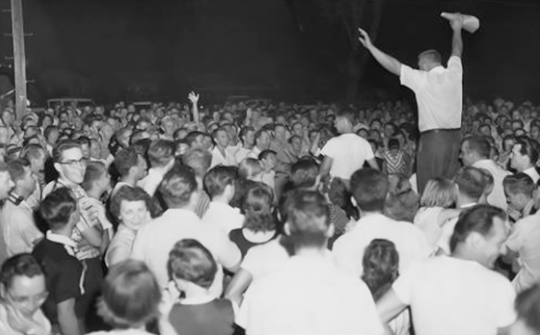 Mob action was often part of community efforts to maintain segregation. A crowd gathered to protest William Myers, a Black man, moving his family into Levittown, New York in 1957.